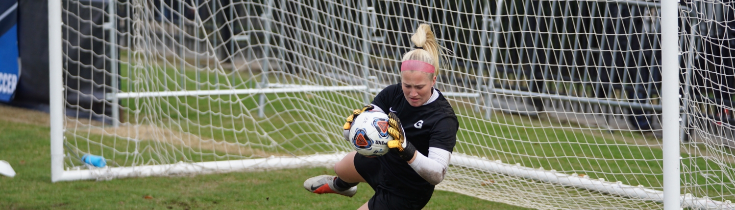 soccer goalkeeper making a save